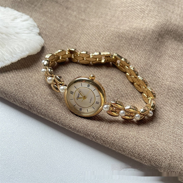 Damenarmbanduhr mit Metallarmband und Perlen