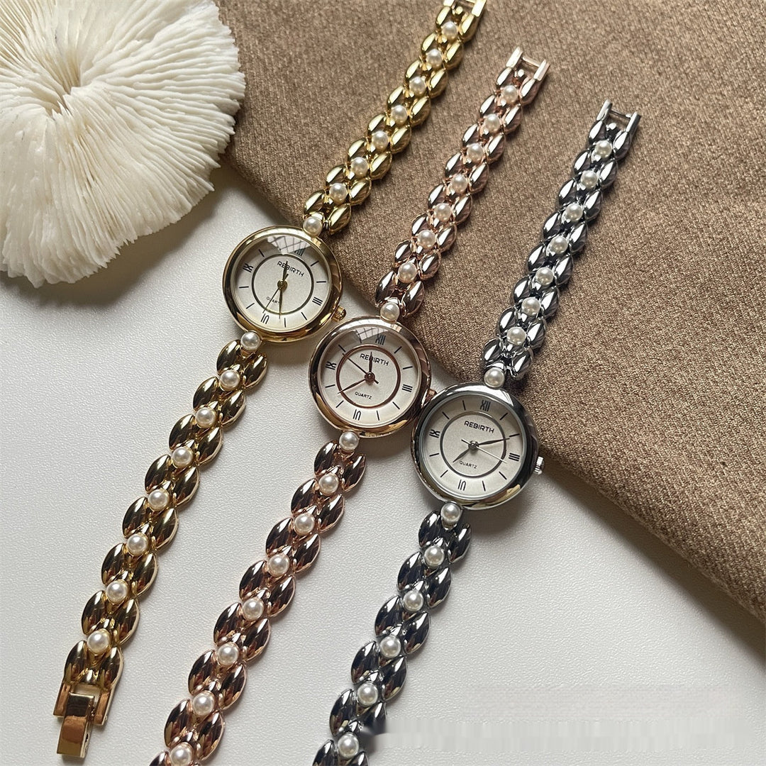 Damenarmbanduhr mit Metallarmband und Perlen