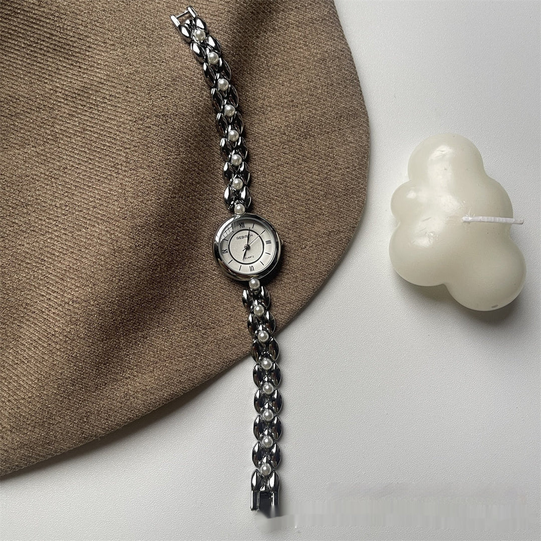 Damenarmbanduhr mit Metallarmband und Perlen
